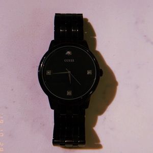 Black sleek Guess watch